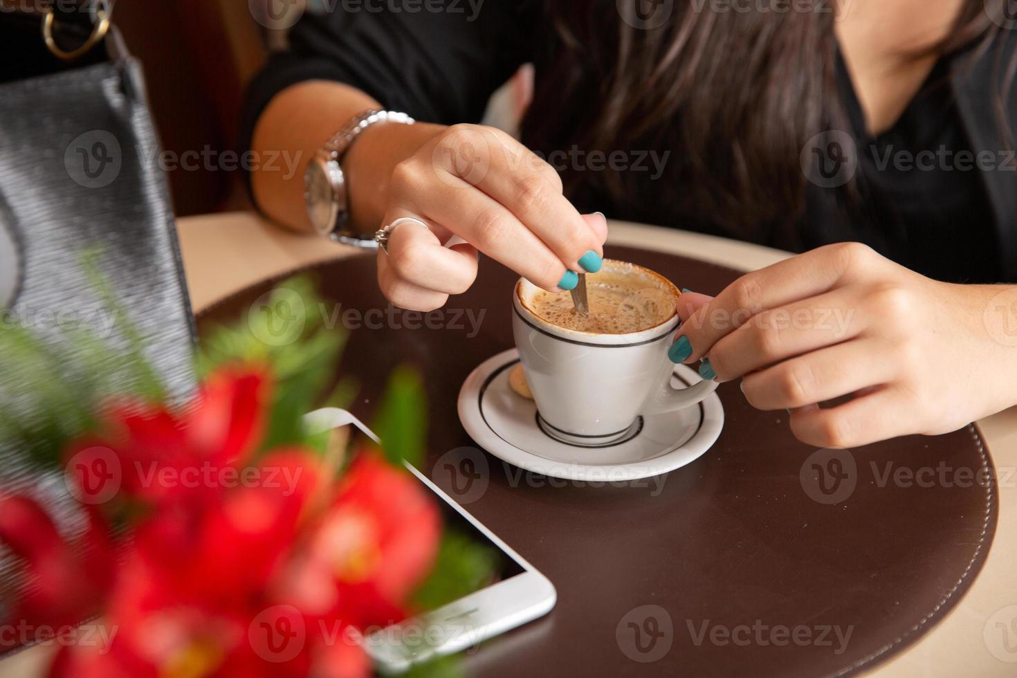 Woman drinking coffee table. Women in cafe. photo
