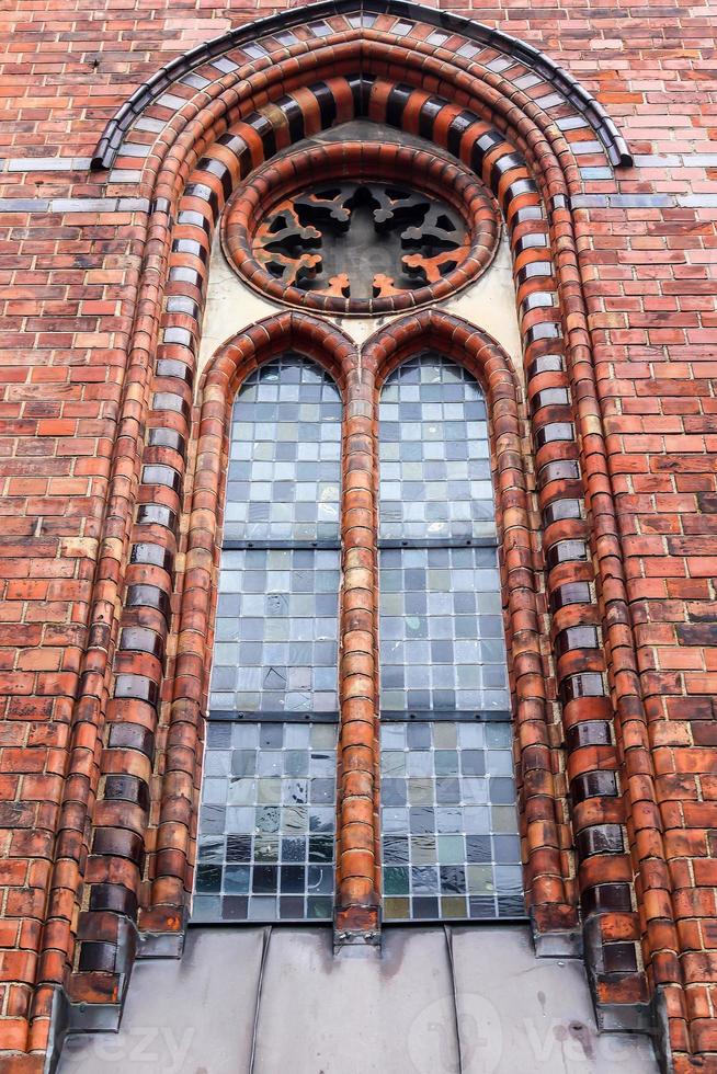 Old weathered and aged religious church building walls and windows photo