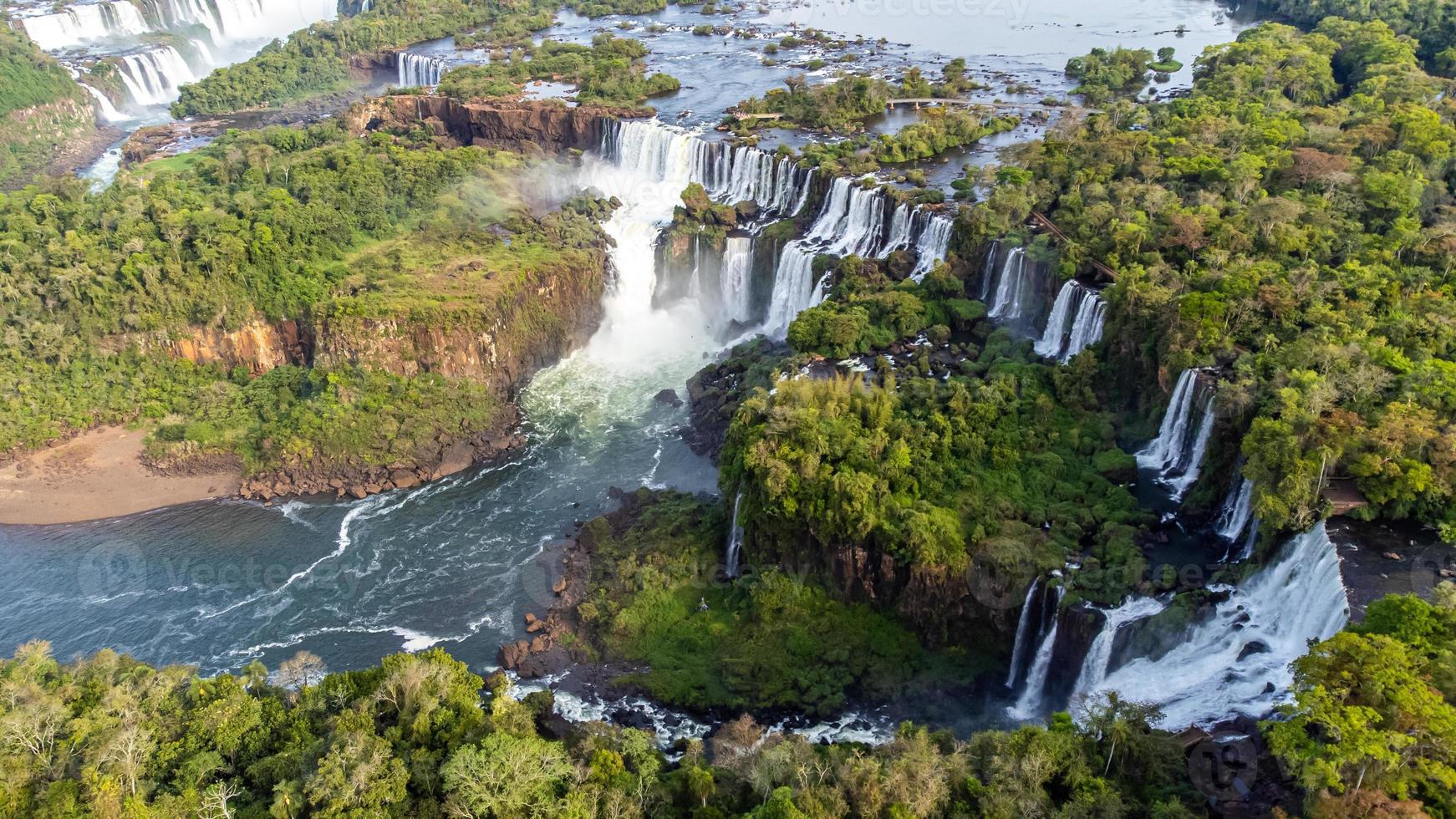 Beautiful aerial view of the Iguassu Falls from a helicopter, one of the Seven Natural Wonders of the World. Foz do Iguacu, Parana, Brazil photo