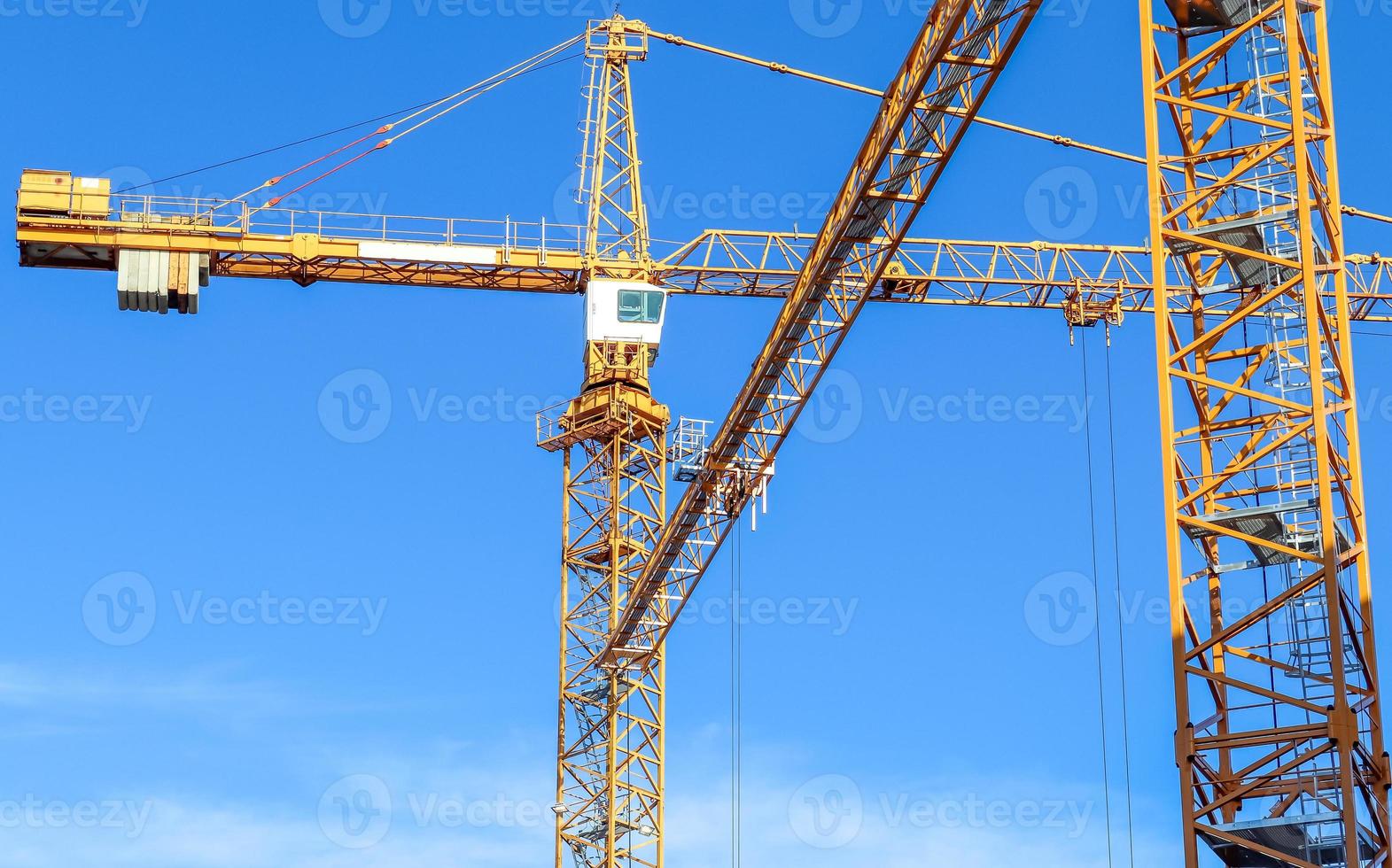 Several cranes on constructions sites at high buildings all over Europe photo