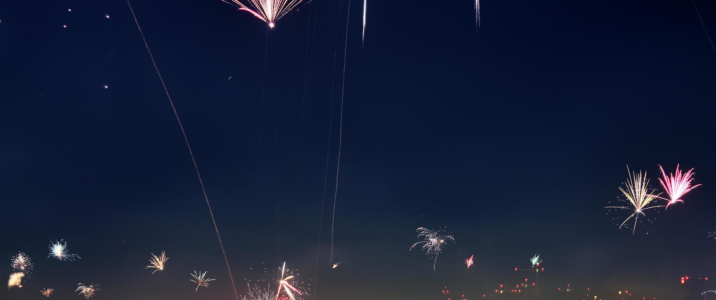 Long time exposure of fireworks over the roofs of vienna photo