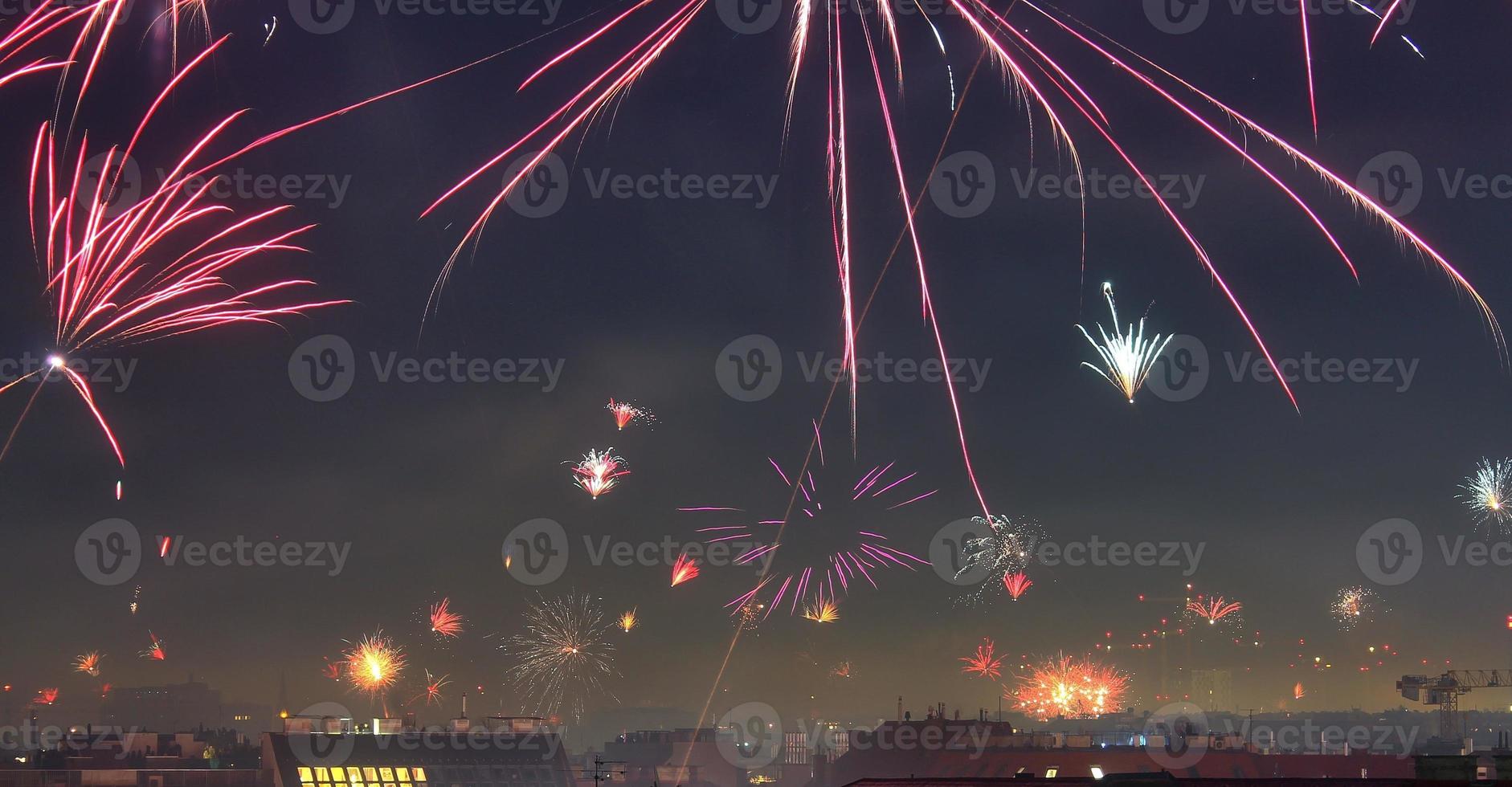 Long time exposure of fireworks over the roofs of vienna photo