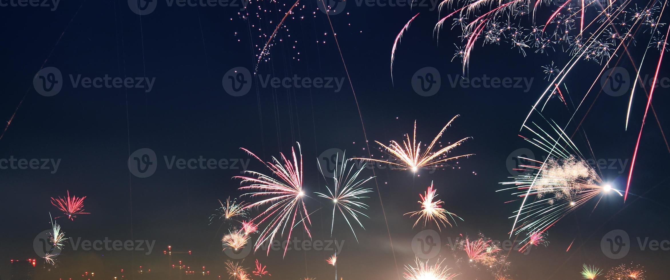 Long time exposure of fireworks over the roofs of vienna photo