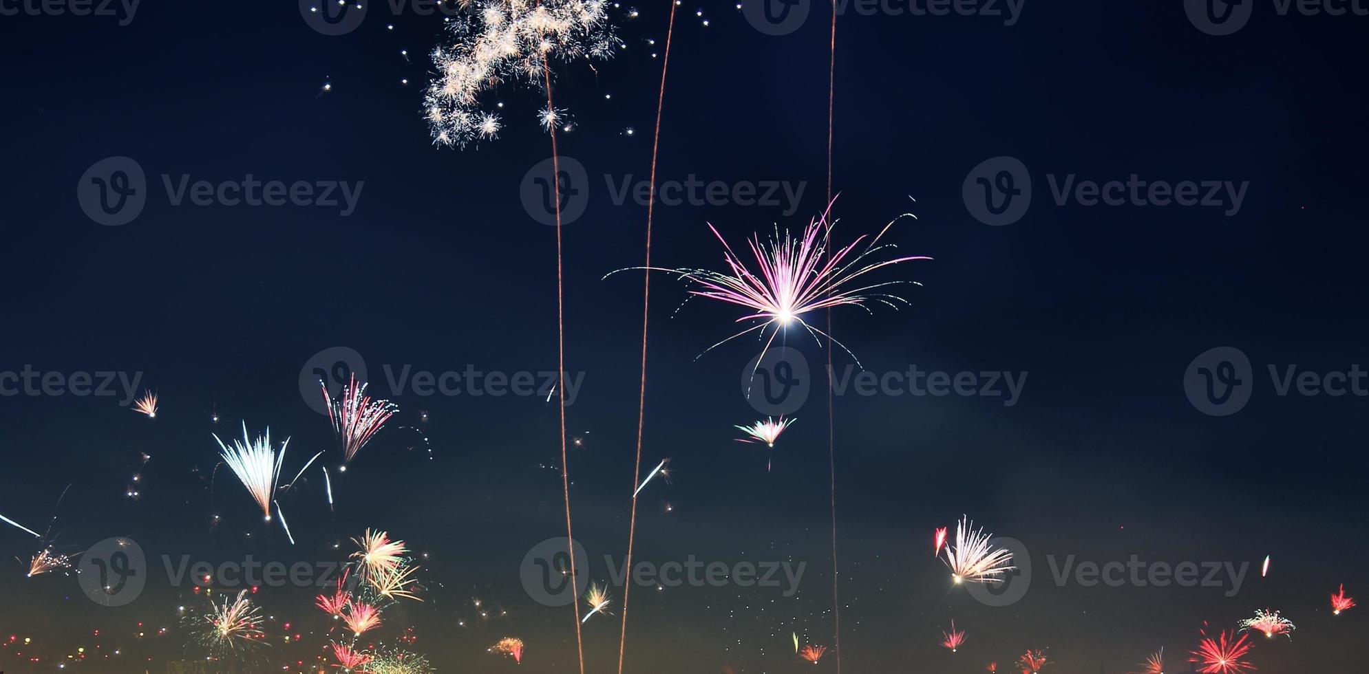 Long time exposure of fireworks over the roofs of vienna photo