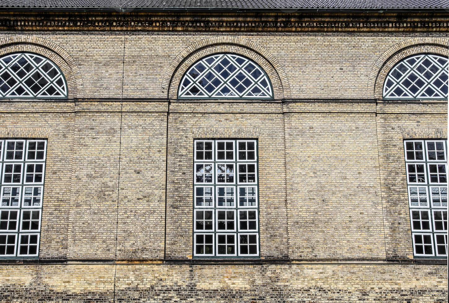 Old weathered and aged religious church building walls and windows photo