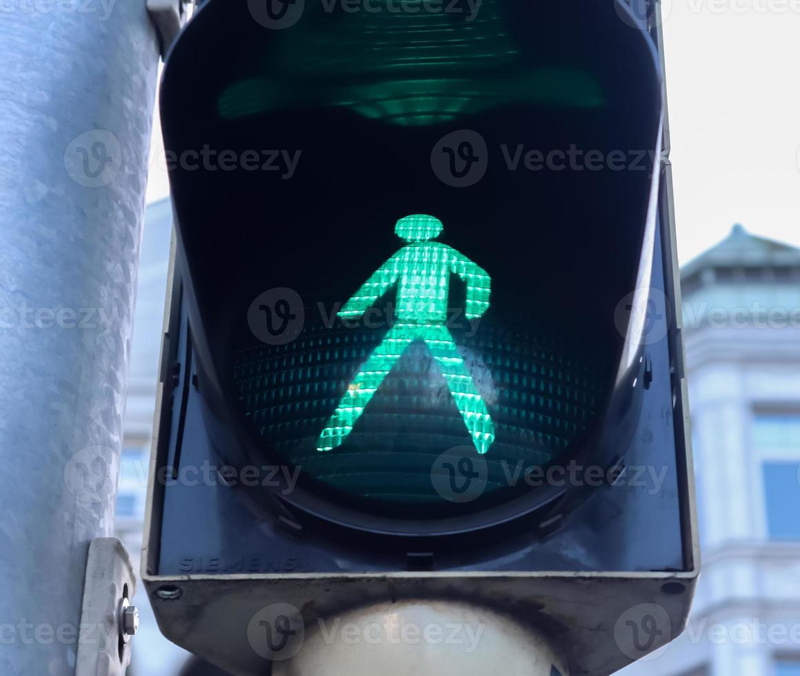 Green and red traffic lights for pedestrians and cars photo