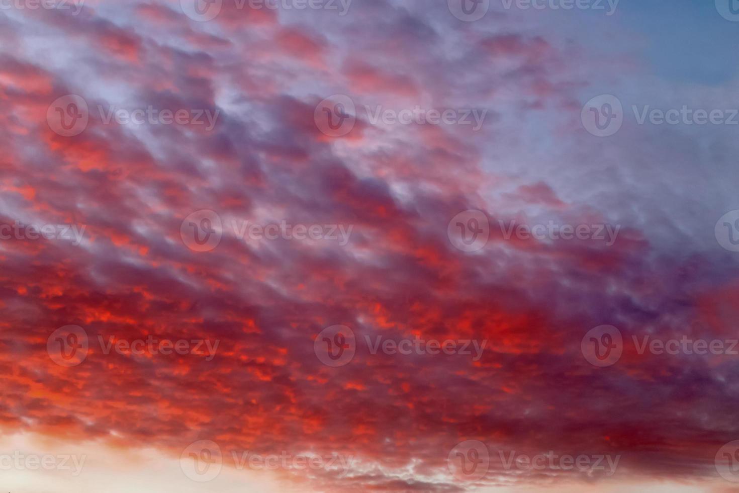 Beautiful panorama of orange and yellow clouds at sunrise photo