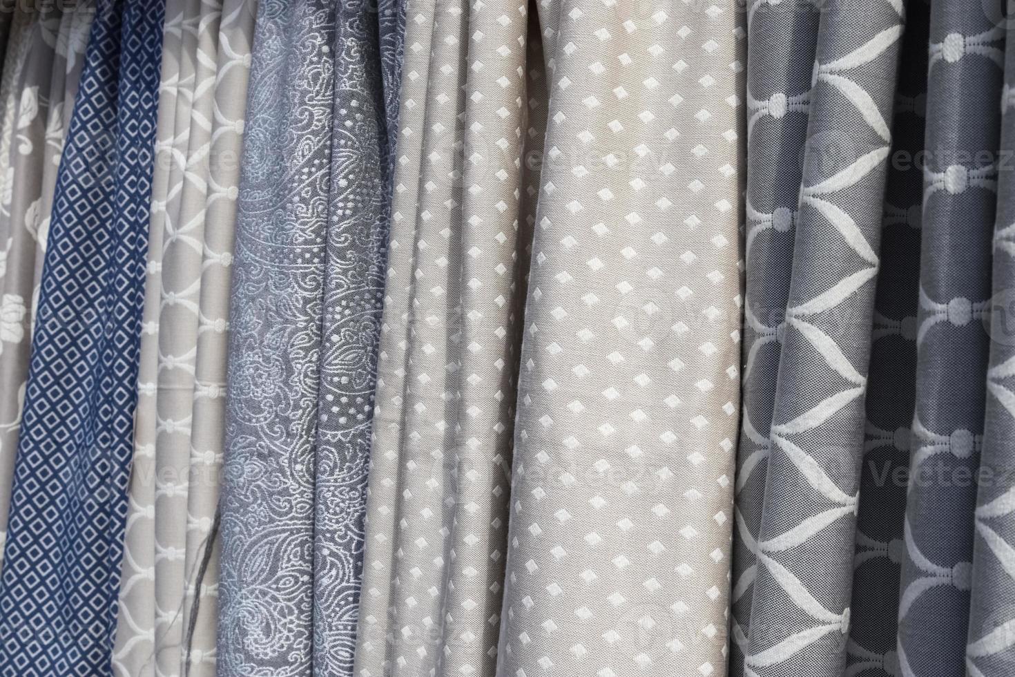 Samples of cloth and fabrics in different colors found at a fabrics market. photo