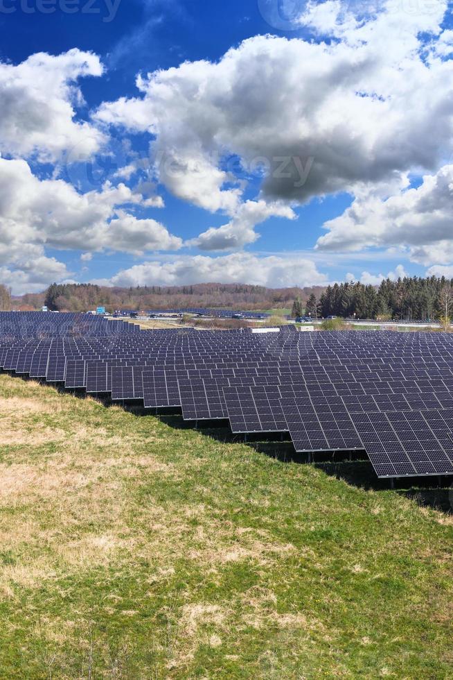 Generating clean energy with solar modules in a big park close to the Highway A7 in northern Germany. photo