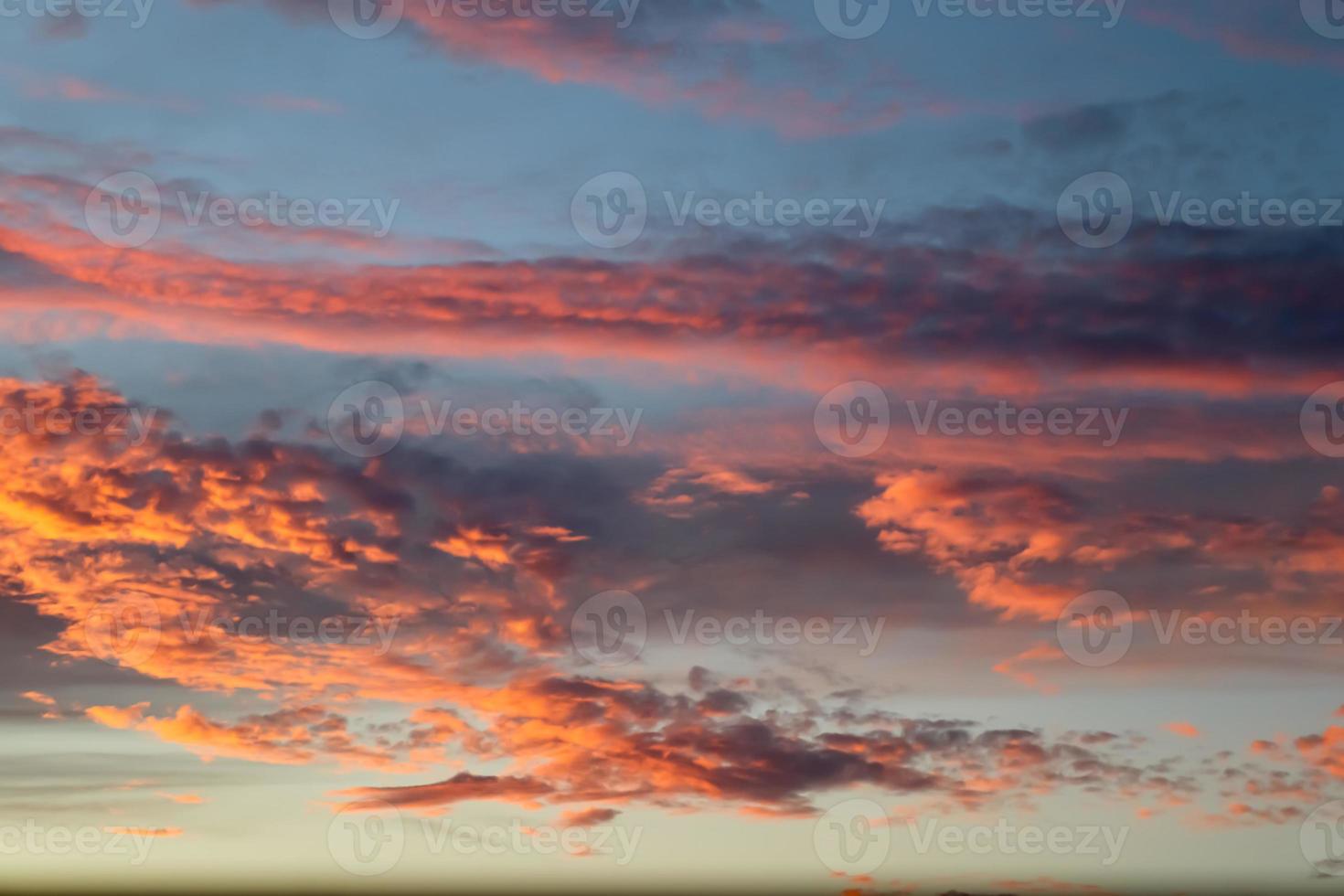 Beautiful panorama of orange and yellow clouds at sunrise photo