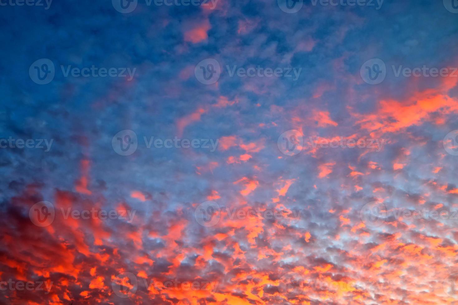 Beautiful panorama of orange and yellow clouds at sunrise photo