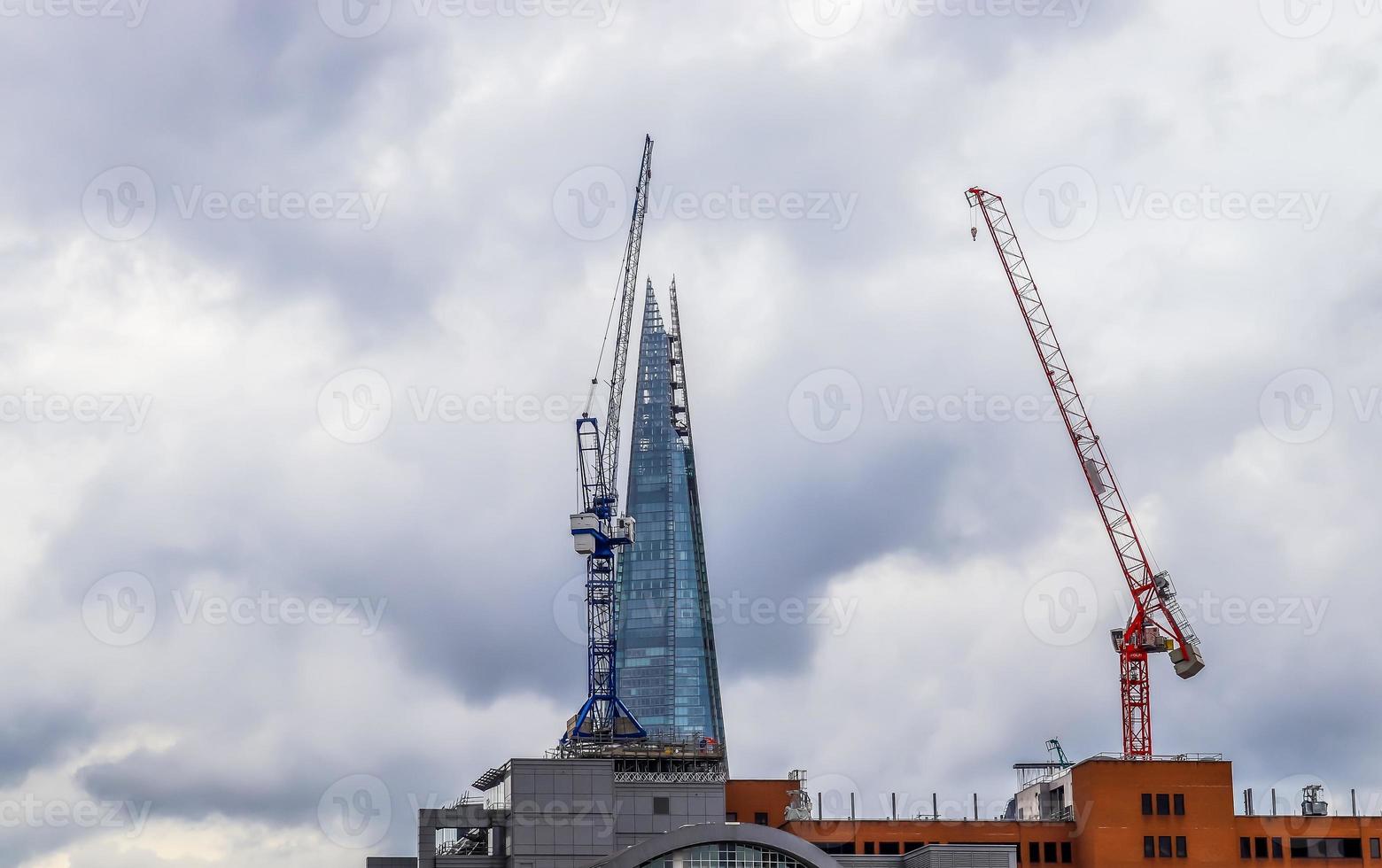 Several cranes on constructions sites at high buildings all over Europe photo