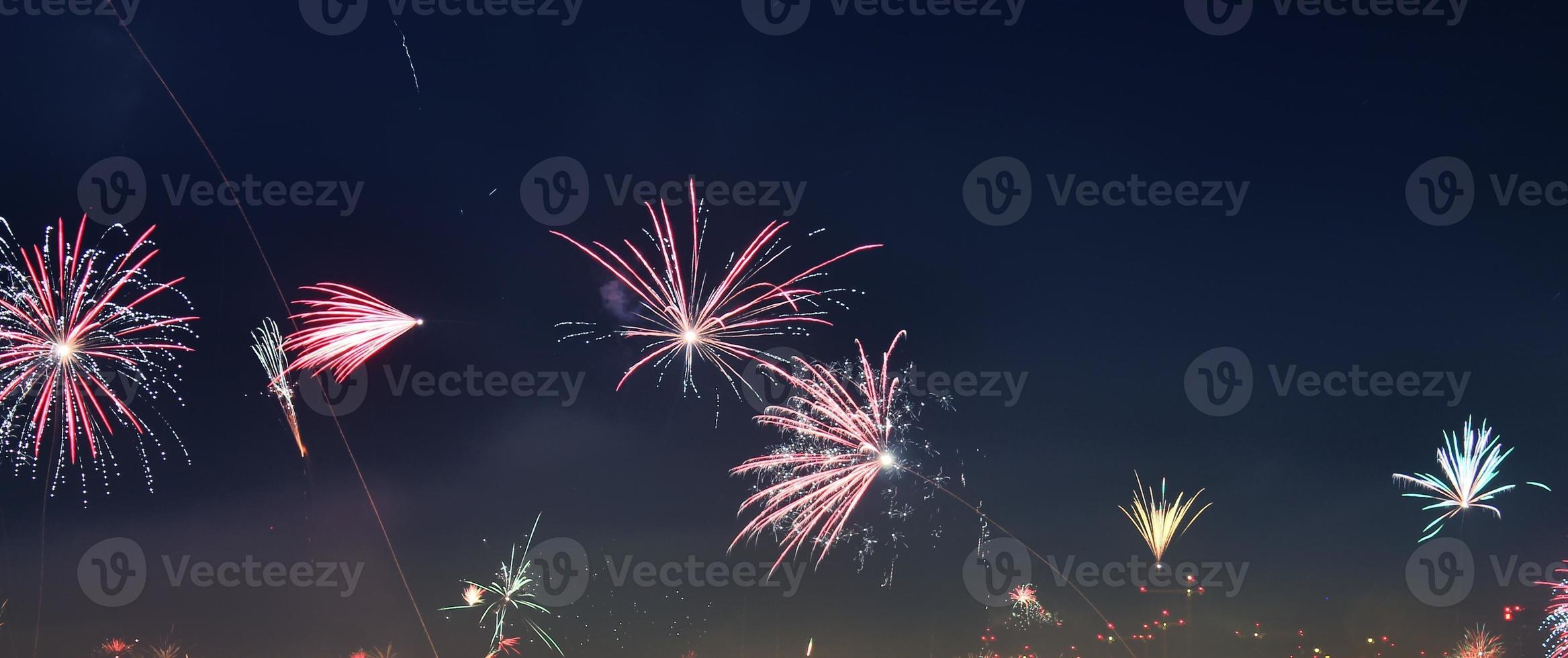 Long time exposure of fireworks over the roofs of vienna photo