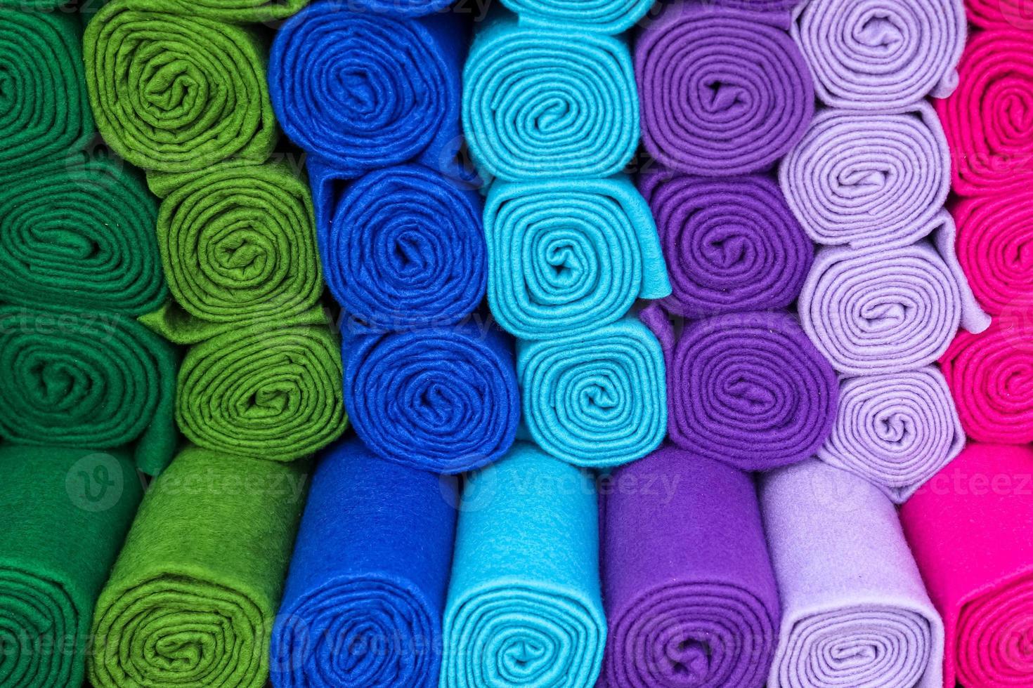 Samples of cloth and fabrics in different colors found at a fabrics market. photo