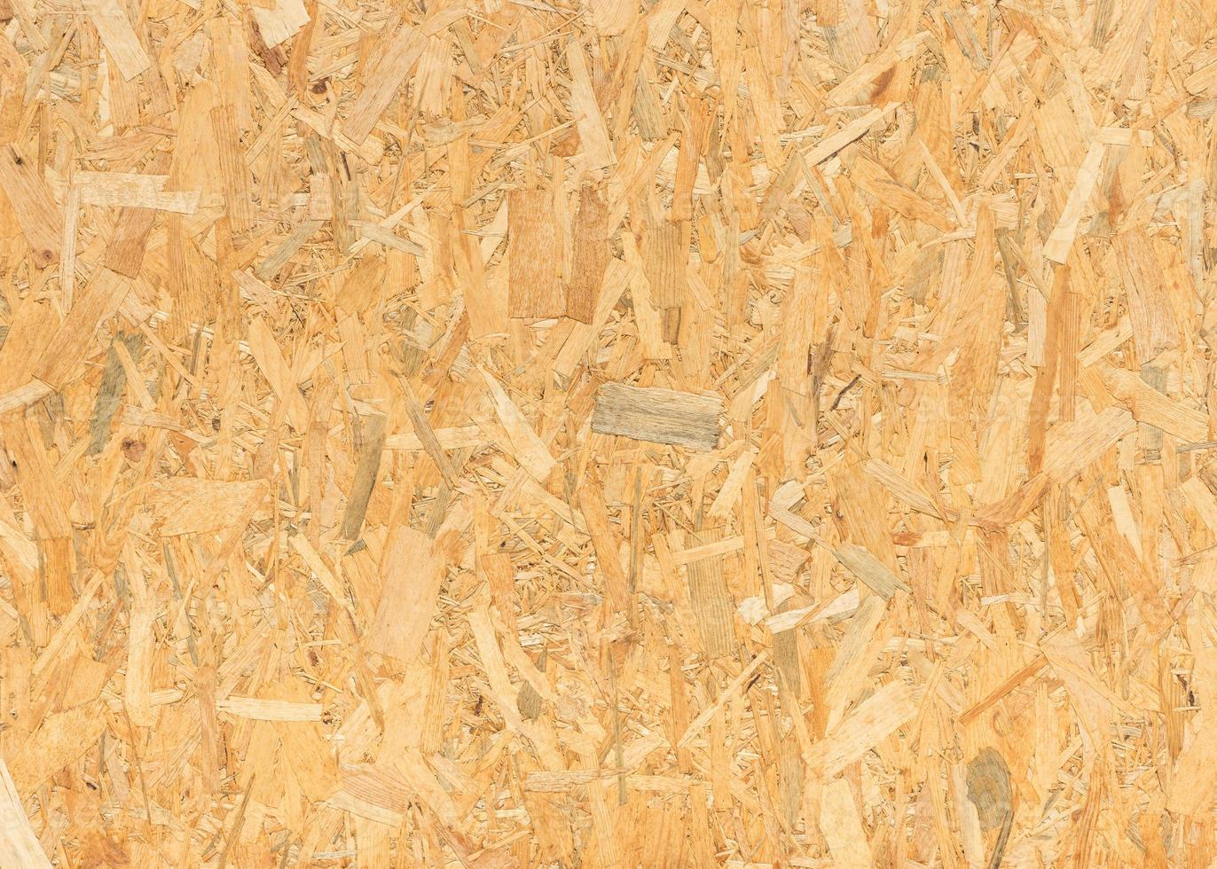 pressed wooden panel background, seamless texture of oriented strand board - OSB wood photo
