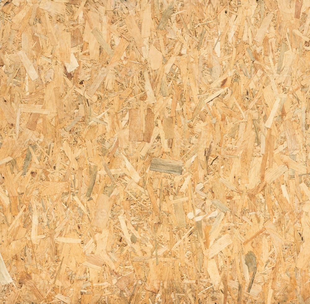 pressed wooden panel background, seamless texture of oriented strand board - OSB wood photo