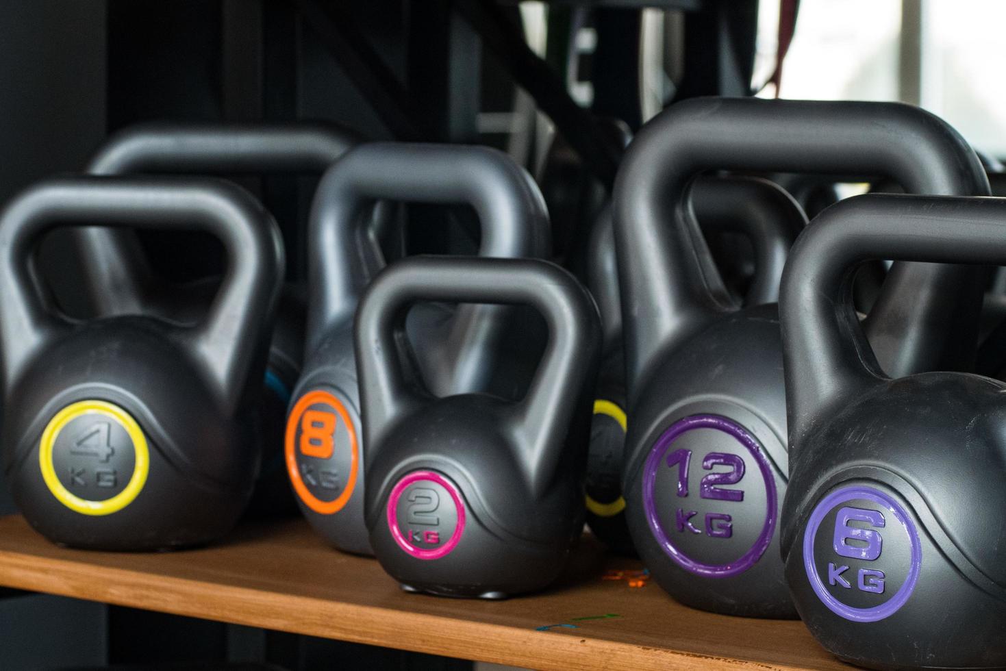 Many random plastic kettlebells photo