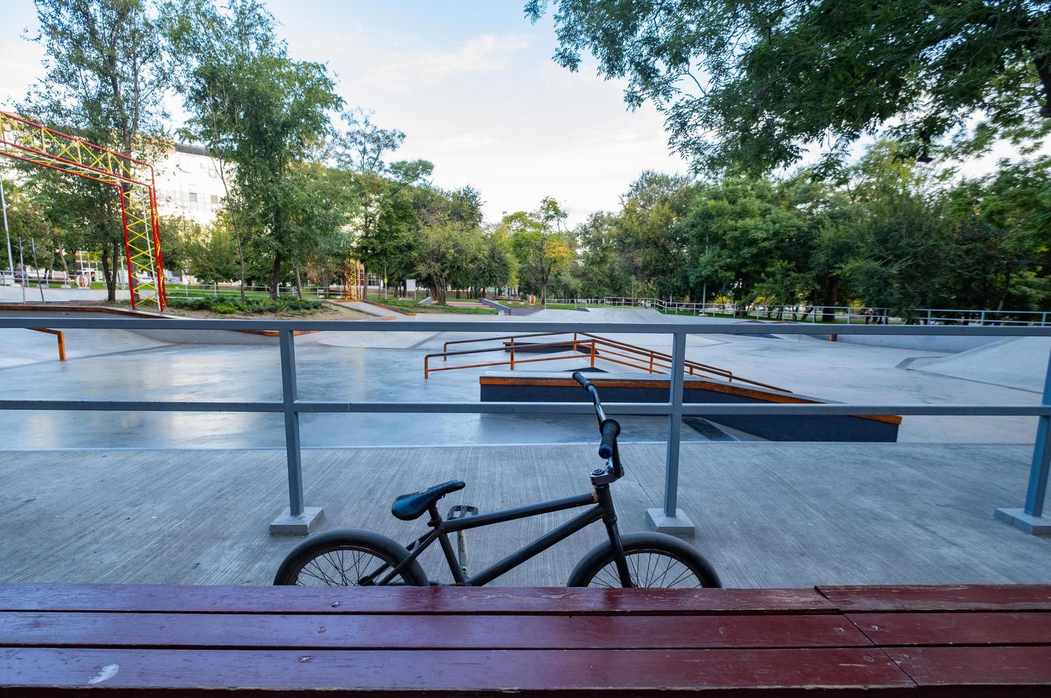 BMX bicycle stand in empty skatepark photo