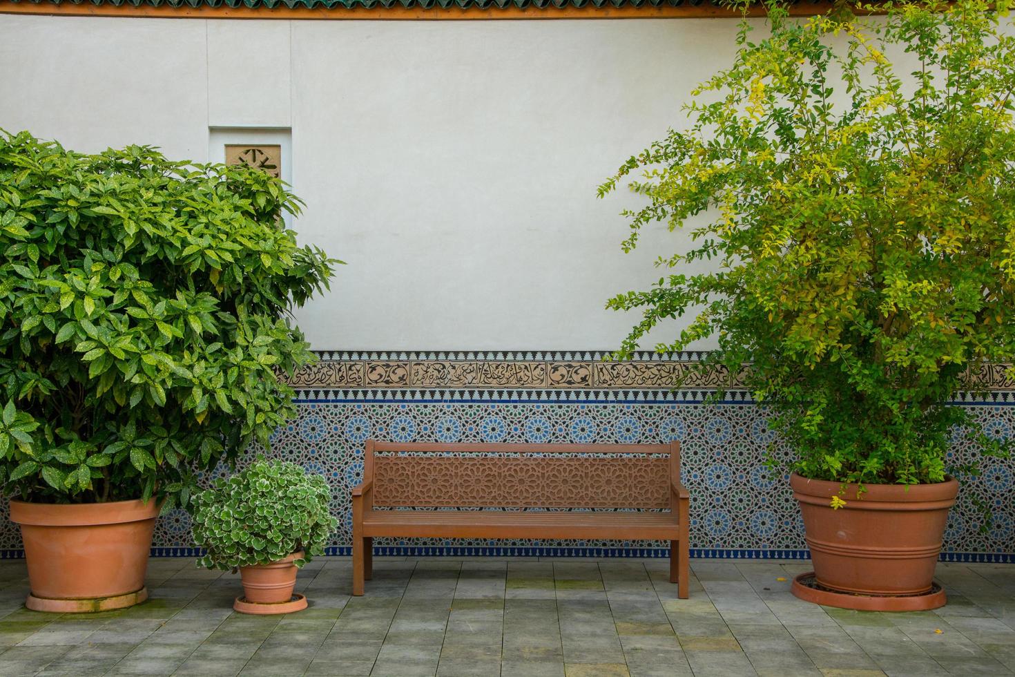 Oriental style park with plants and part of turkish architecture photo