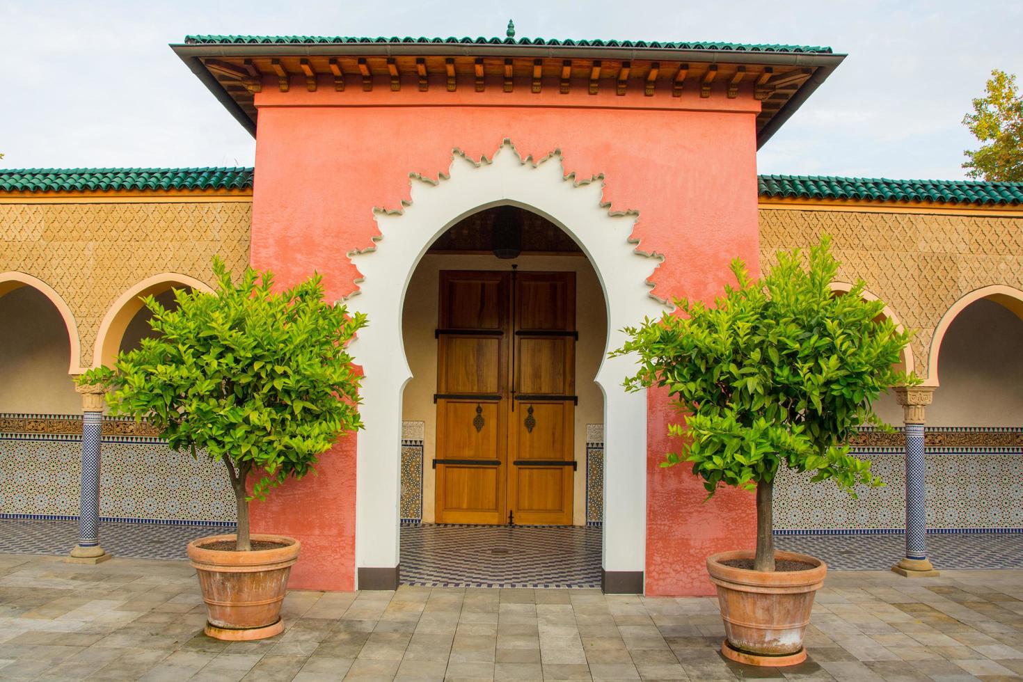 Oriental style park with plants and part of turkish architecture photo