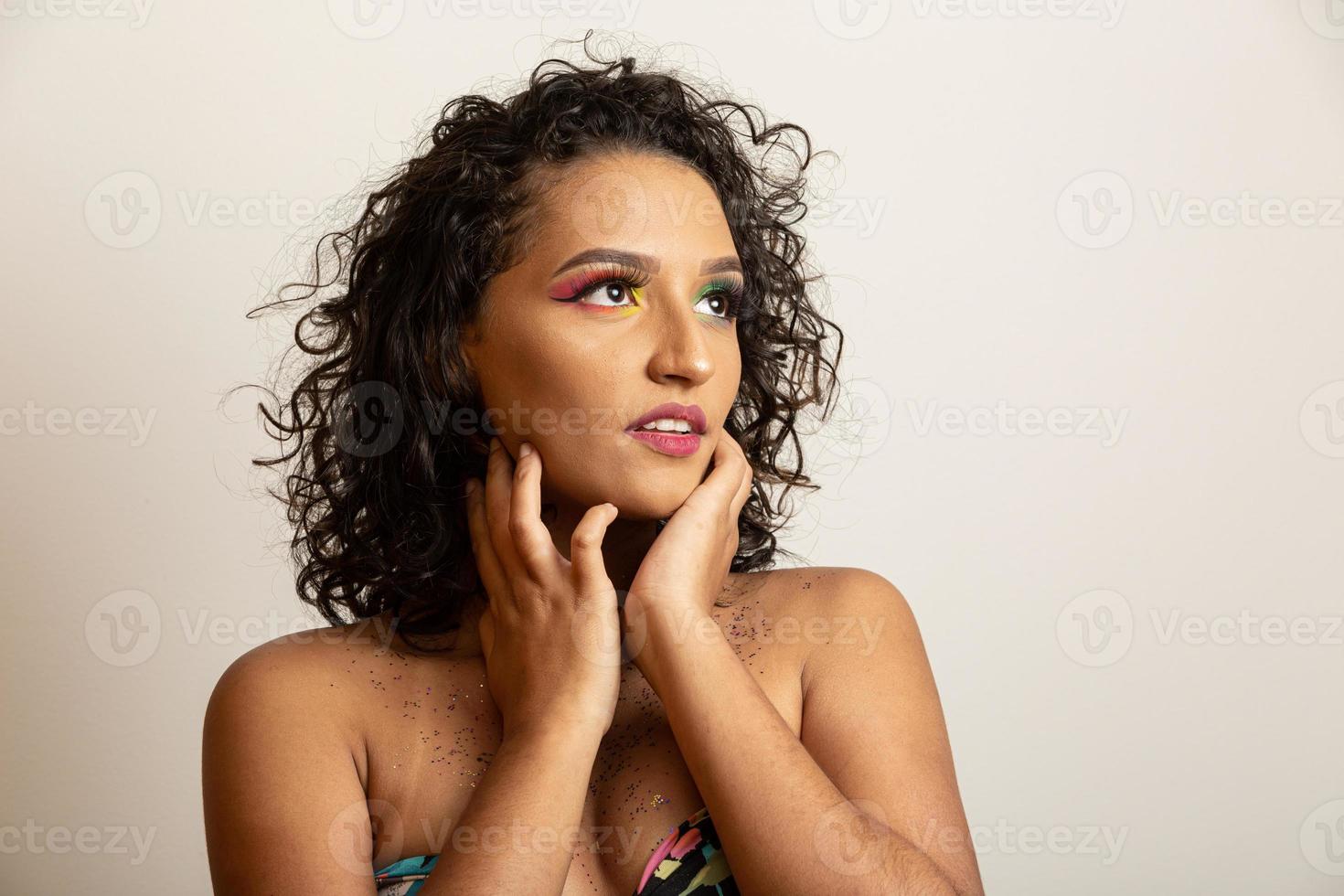 Beauty Fashion Model Girl with Curly Hair and Colorful Makeup. Afro woman smiling photo