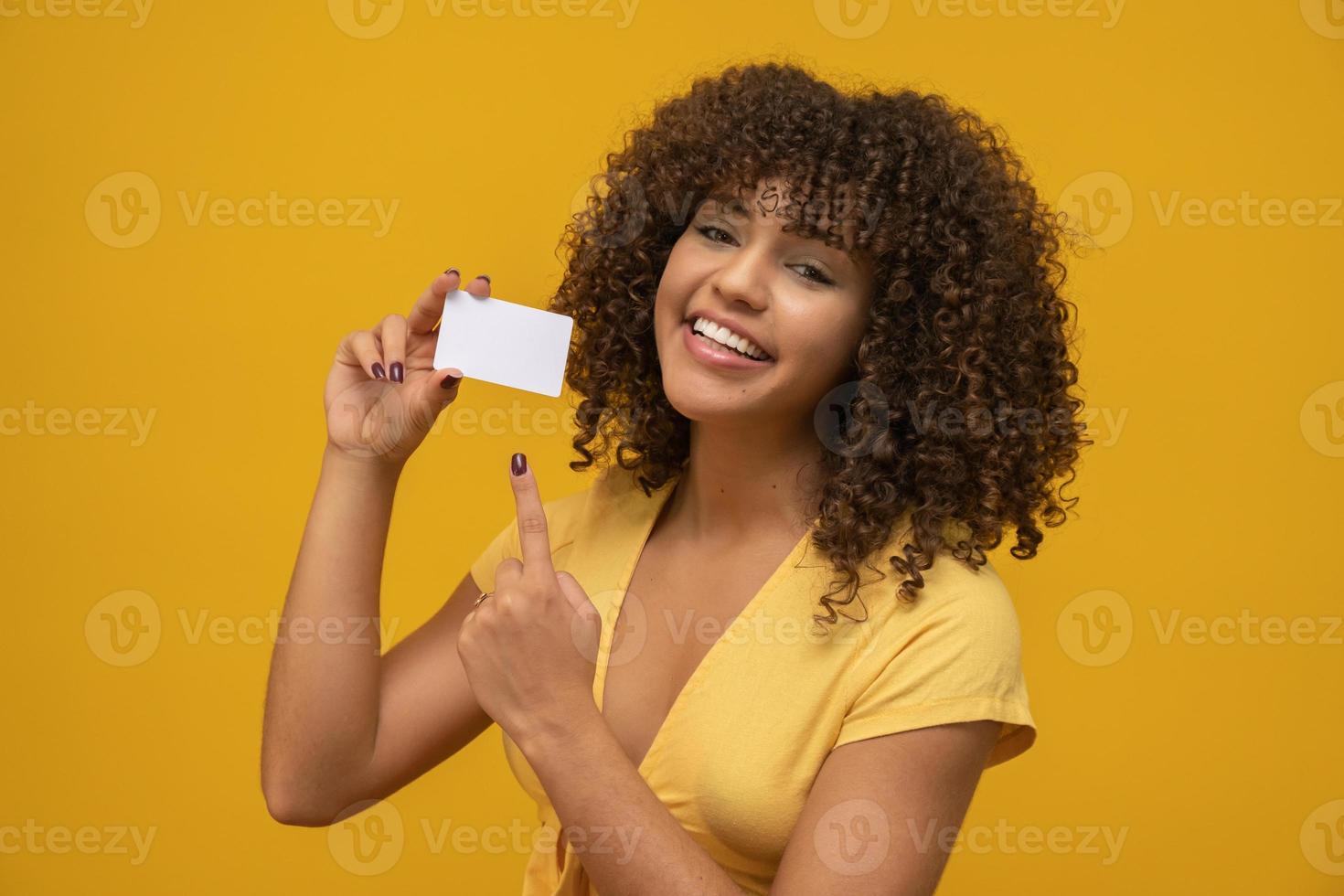 Young woman hand hold blank white card mockup with rounded corners. Plain call-card mock up template holding arm. Plastic credit namecard display front. Check offset card design. Business branding. photo