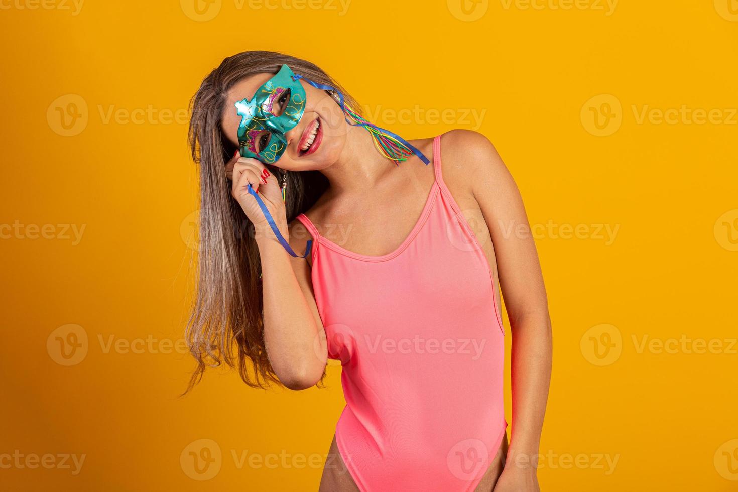 Brazilian Carnival. Young woman in costume enjoying the carnival party. photo