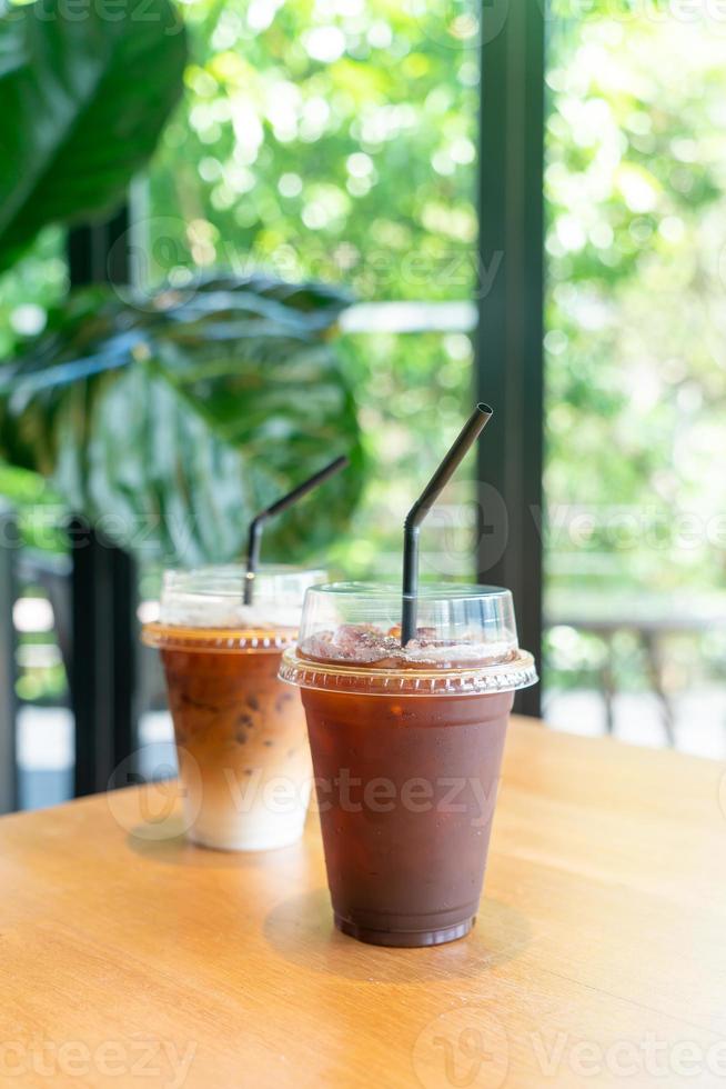 iced black coffee takeaway glass on table in coffee shop cafe restaurant photo