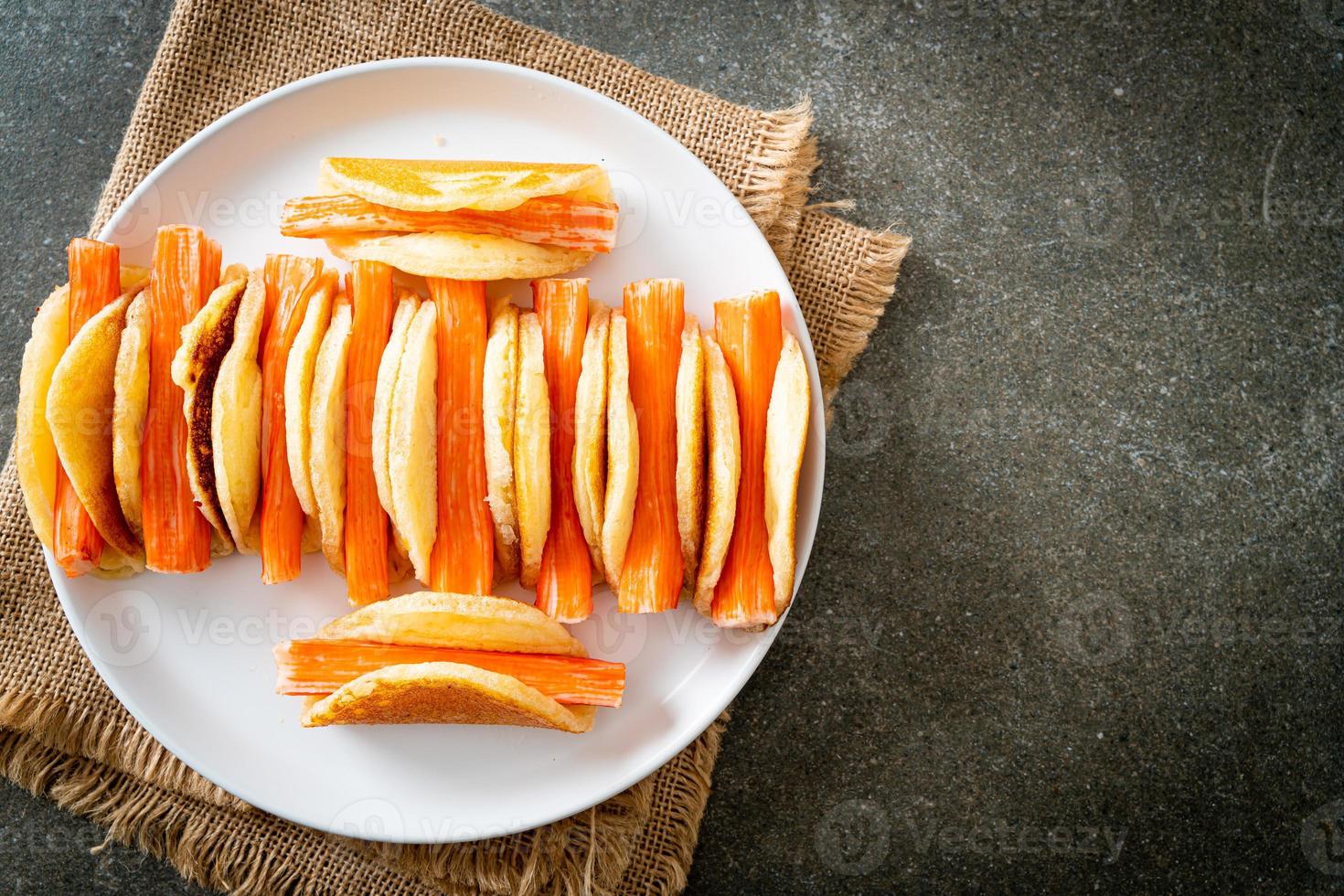 flat pancake roll with crab stick photo