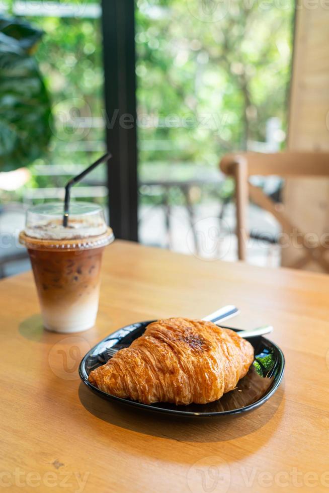 butter croissant on black plate photo