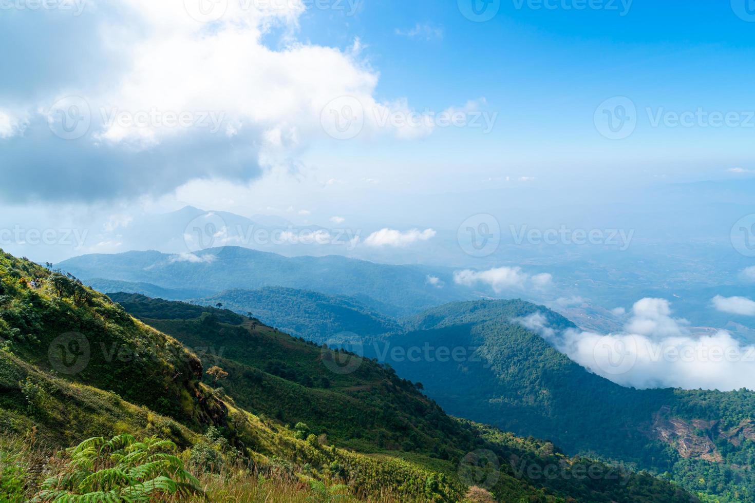 beautiful mountain layer with clouds and blue sky photo