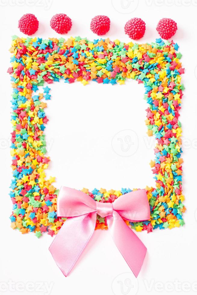 Colorful frame candy, lollipop and sweets isolated on white background. Sweet food. Top view. Selective focus. photo