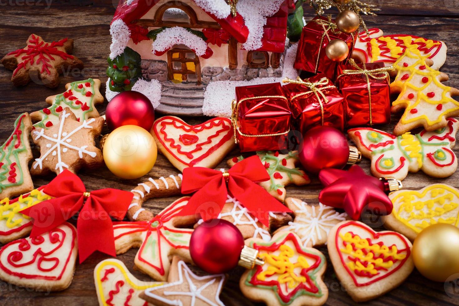 Christmas toys and sweet cookies on wooden table. Top view and selective focus. Happy New Year concept photo