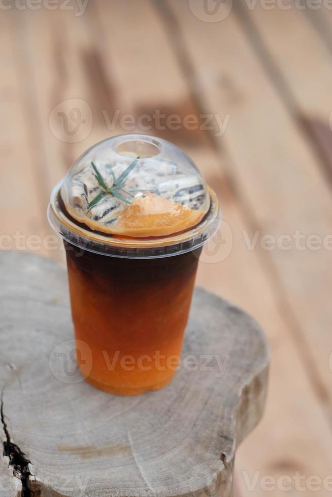 Orange black coffee menu on wooden plate. photo