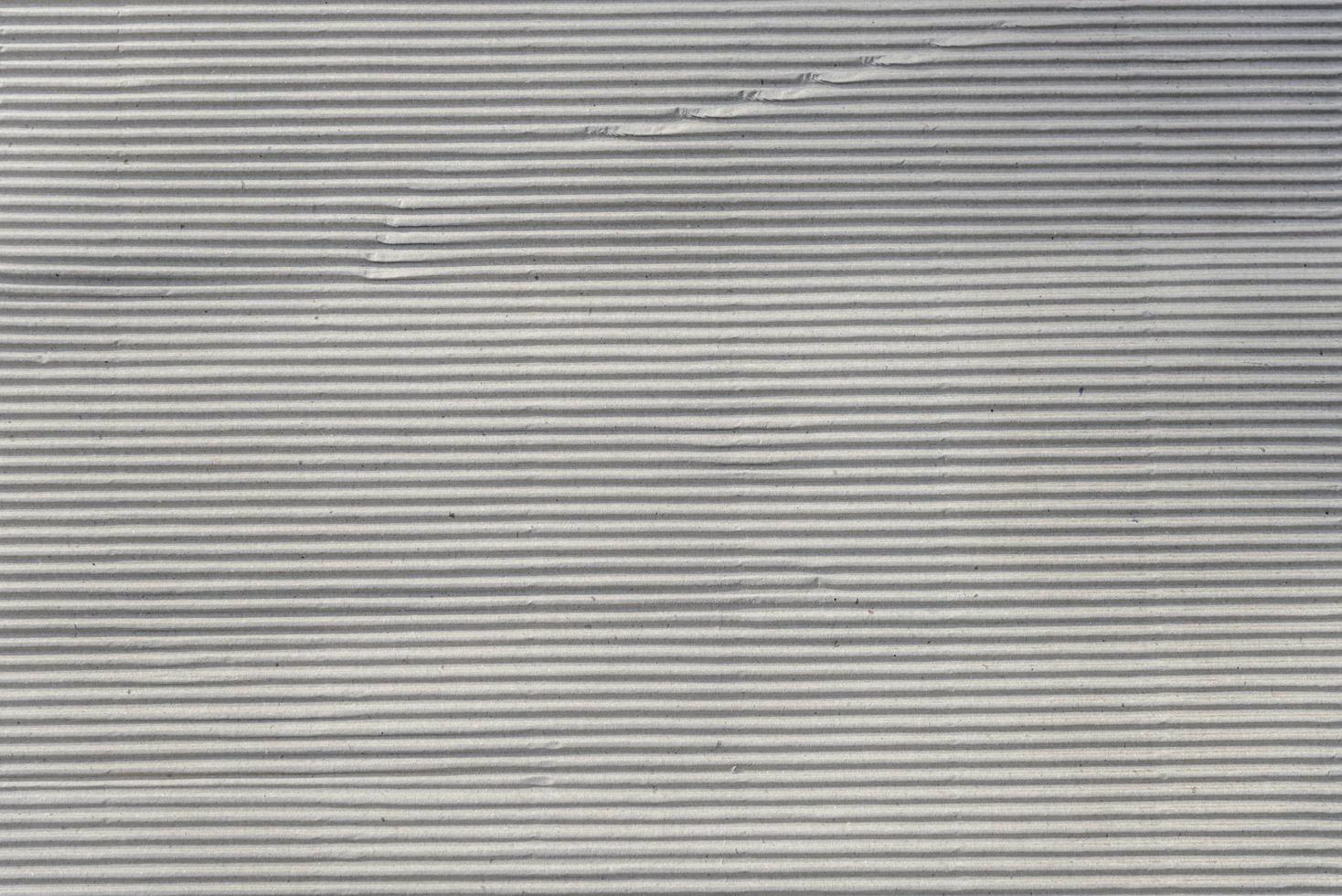 Corrugated cardboard sheet texture useful as a background photo