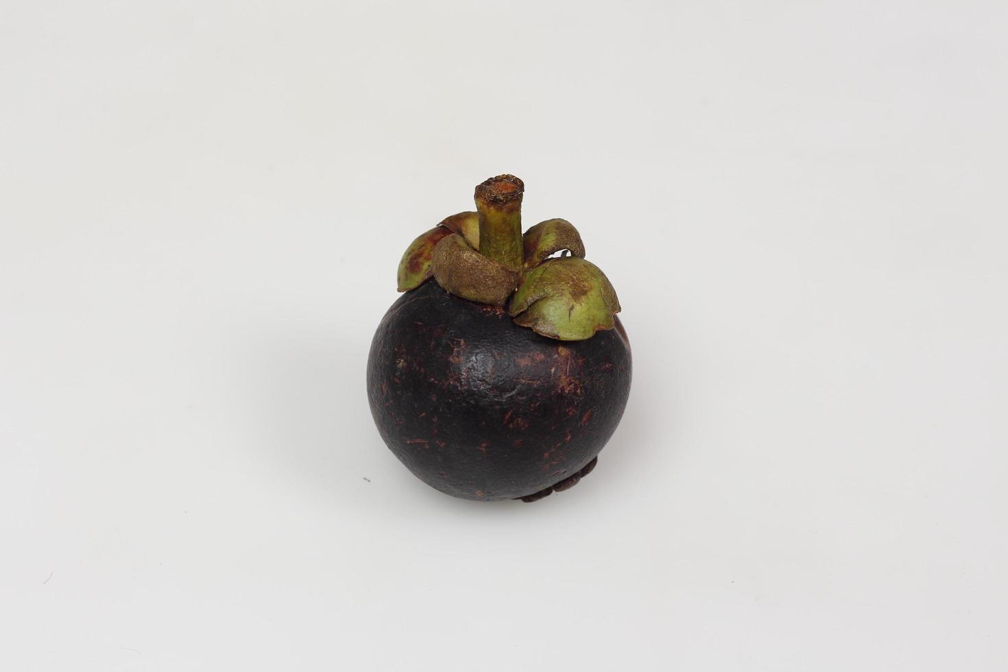 Mangosteen is a tropical fruit from Asia. Mangosteen has a distinctive sweet and sour taste. Mangosteen also has a myriad of benefits, properties, and nutritional content that is useful for health. photo