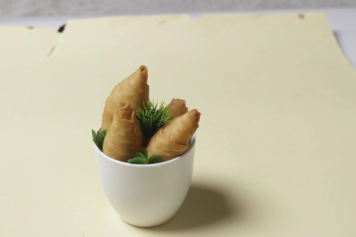 Savory molen banana cake for snacks to accompany the breakfast menu. Molen bananas with pastries are usually served with a cup of hot coffee or tea. Market snacks. Focus blur. Focus on some angels. photo