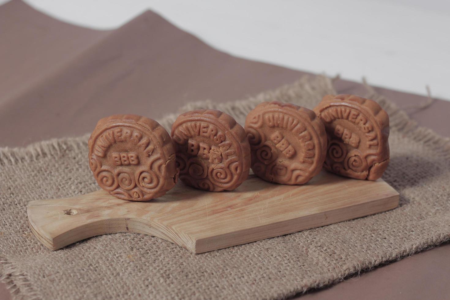 Square-shaped chocolate biscuits are suitable as a side snack to the breakfast menu. Start the morning with biscuits. Can be consumed by all ages from toddlers to the elderly. Stack of biscuits. photo