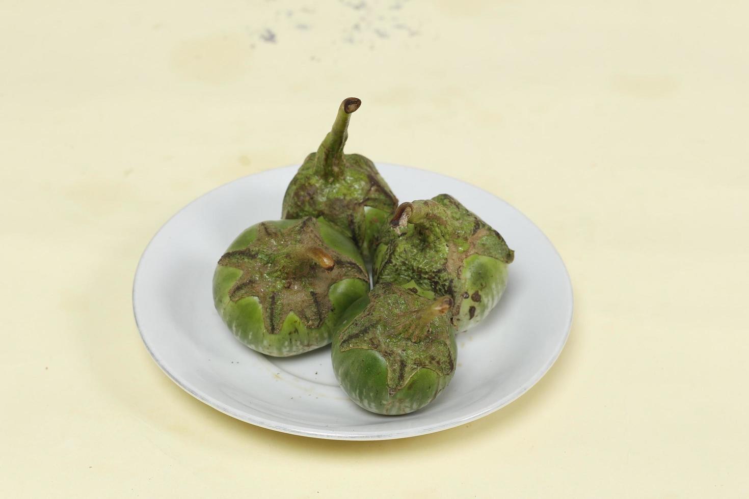 Eggplant is one of the vegetables in the form of fruit. Fruit-producing plants used as vegetables. Green eggplant is round and mini has a different taste from other eggplants. photo