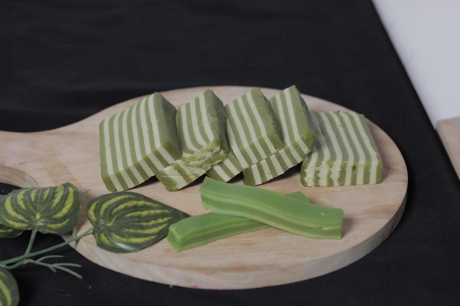 Original and pandan flavored layer cake. Layer cake is ready to accompany your morning with a glass of tea. Indonesian cake. We often see it as a side dish during Eid. Sweet and soft cake. Focus blur. photo