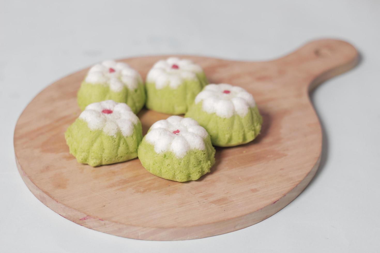 Putu Ayu as a snack in your spare time. Putu Ayu has a soft and tender texture. This putu cake has a very delicious and soft taste when eaten. Indonesian food. Has a pandan scent. Focus blur. photo