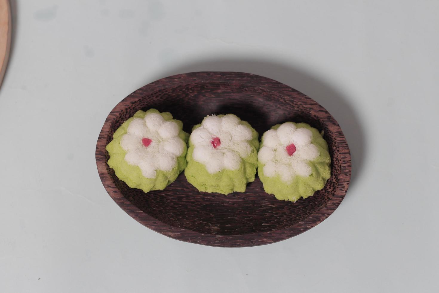 Putu Ayu as a snack in your spare time. Putu Ayu has a soft and tender texture. This putu cake has a very delicious and soft taste when eaten. Indonesian food. Has a pandan scent. Focus blur. photo