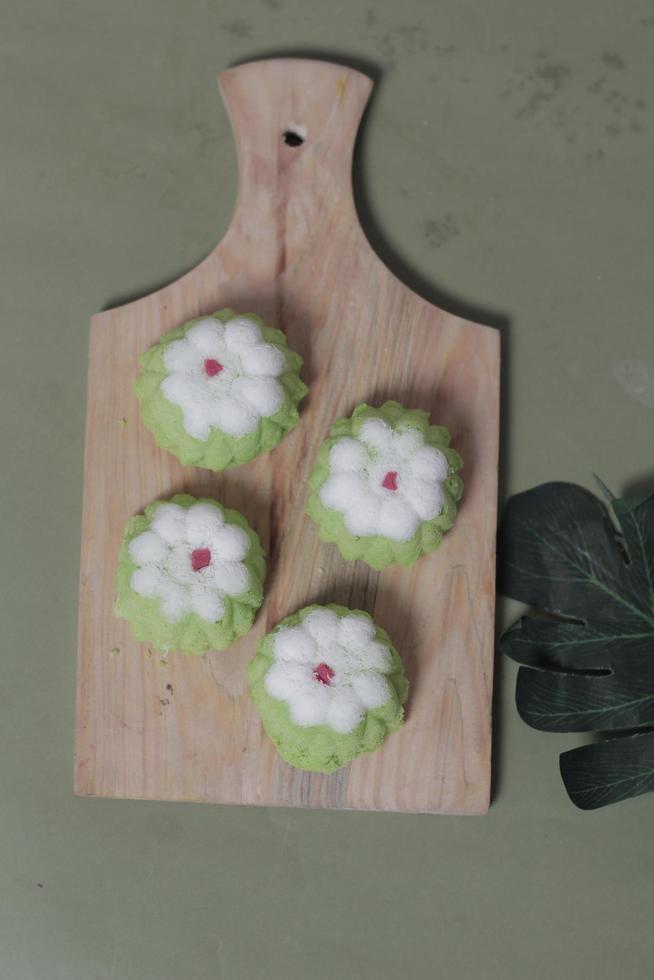 Putu Ayu as a snack in your spare time. Putu Ayu has a soft and tender texture. This putu cake has a very delicious and soft taste when eaten. Indonesian food. Has a pandan scent. Focus blur. photo