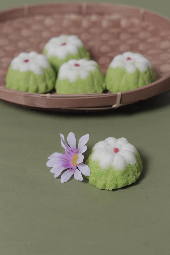 Putu Ayu as a snack in your spare time. Putu Ayu has a soft and tender texture. This putu cake has a very delicious and soft taste when eaten. Indonesian food. Has a pandan scent. Focus blur. photo