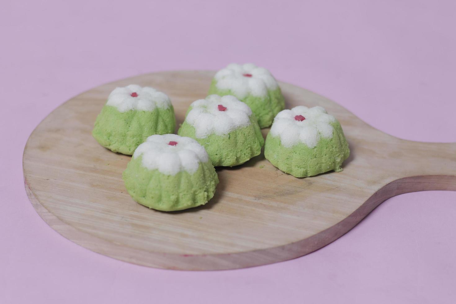 Putu Ayu as a snack in your spare time. Putu Ayu has a soft and tender texture. This putu cake has a very delicious and soft taste when eaten. Indonesian food. Has a pandan scent. Focus blur. photo