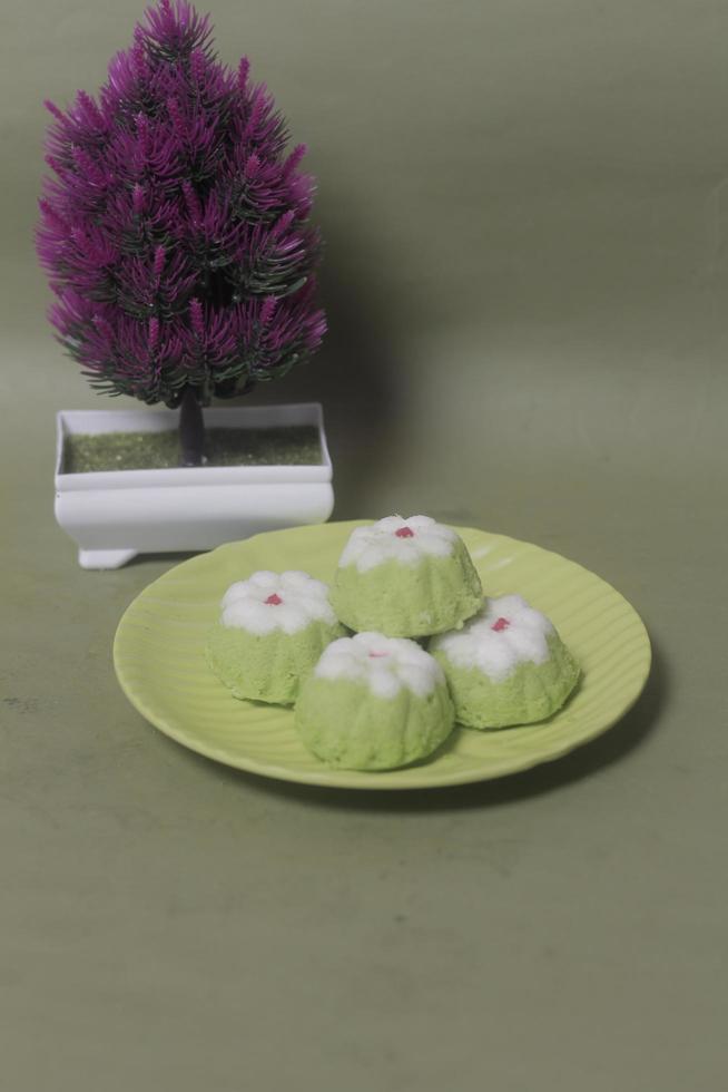 Putu Ayu as a snack in your spare time. Putu Ayu has a soft and tender texture. This putu cake has a very delicious and soft taste when eaten. Indonesian food. Has a pandan scent. Focus blur. photo