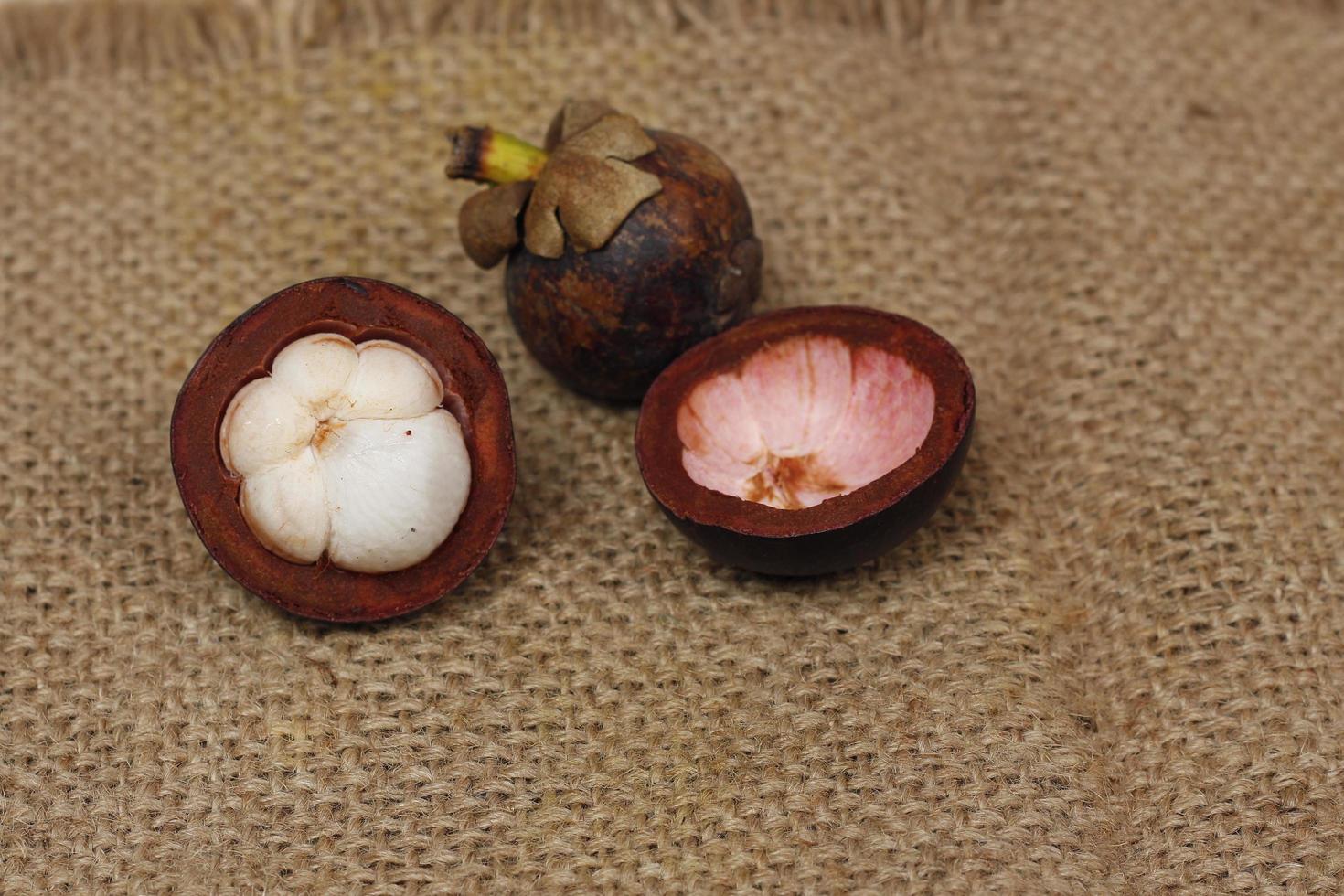Mangosteen is a tropical fruit from Asia. Mangosteen has a distinctive sweet and sour taste. Mangosteen also has a myriad of benefits, properties, and nutritional content that is useful for health. photo