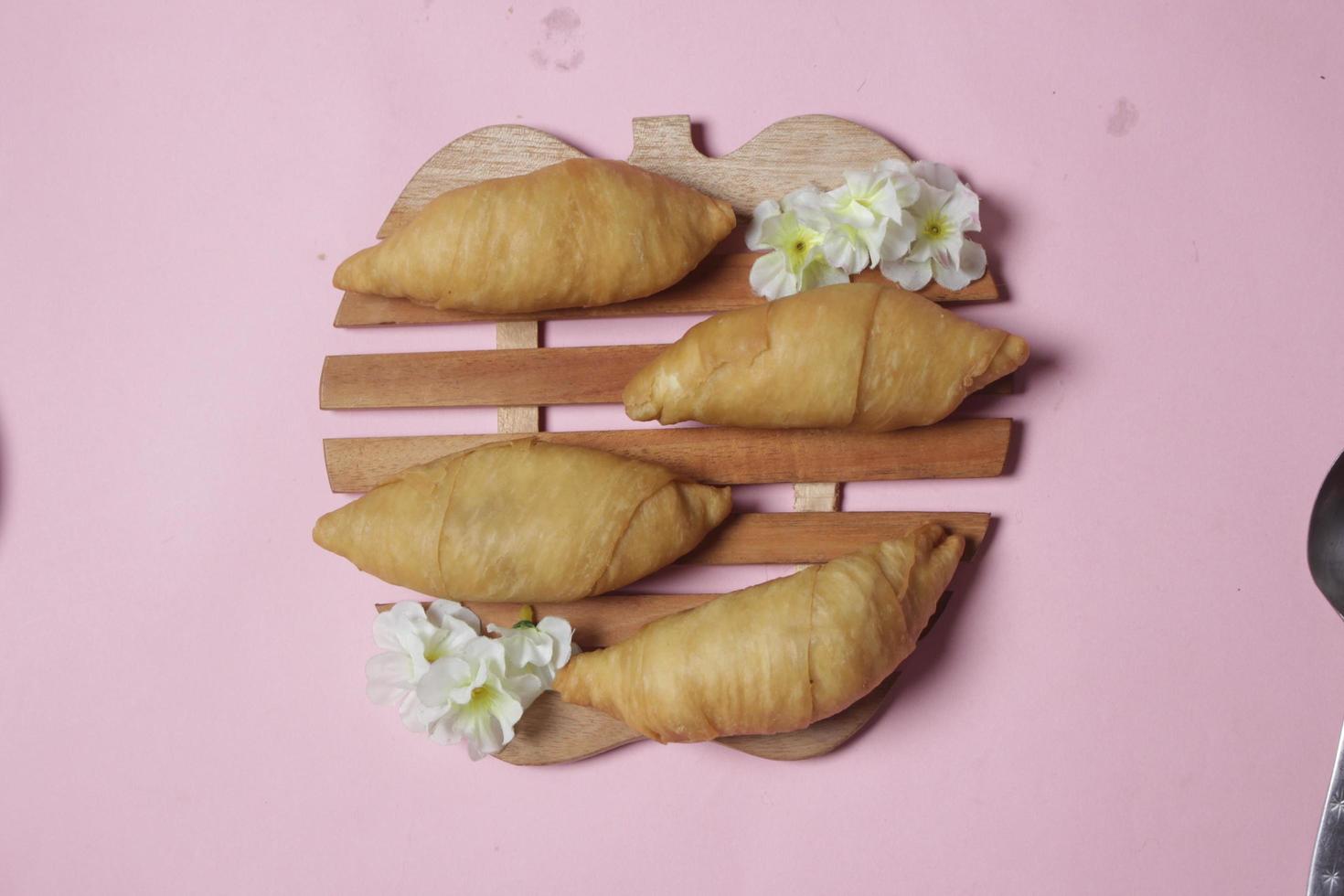 Chocolate bananas from raw materials covered with rolls of pastry dough sheets. Molen bananas with pastries are usually served with a cup of hot coffee or tea. Focus blur photo