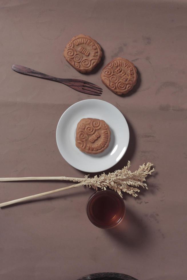 Square-shaped chocolate biscuits are suitable as a side snack to the breakfast menu. Start the morning with biscuits. Can be consumed by all ages from toddlers to the elderly. Stack of biscuits. photo