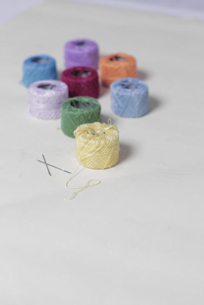 Embroidery thread made especially for embroidery. Yarn with a fine and soft texture. Embroidery threads of various colors. Yarn mockup. Focus blur. photo